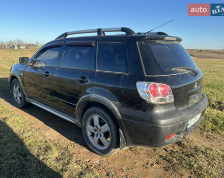 Черный Мицубиси Аутлендер, объемом двигателя 2.38 л и пробегом 230 тыс. км за 5350 $, фото 5 на Automoto.ua