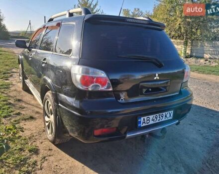 Чорний Міцубісі Аутлендер, об'ємом двигуна 2.38 л та пробігом 320 тис. км за 5600 $, фото 11 на Automoto.ua
