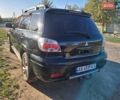 Чорний Міцубісі Аутлендер, об'ємом двигуна 2.38 л та пробігом 320 тис. км за 5600 $, фото 11 на Automoto.ua