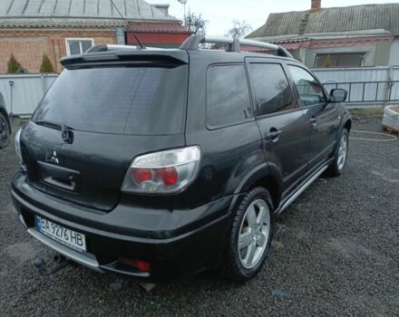 Черный Мицубиси Аутлендер, объемом двигателя 2 л и пробегом 200 тыс. км за 5100 $, фото 15 на Automoto.ua