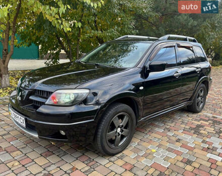 Чорний Міцубісі Аутлендер, об'ємом двигуна 2.38 л та пробігом 247 тис. км за 5499 $, фото 7 на Automoto.ua