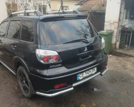 Черный Мицубиси Аутлендер, объемом двигателя 2.4 л и пробегом 280 тыс. км за 5455 $, фото 2 на Automoto.ua