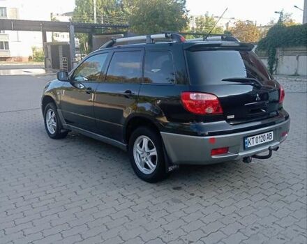 Черный Мицубиси Аутлендер, объемом двигателя 2 л и пробегом 297 тыс. км за 4550 $, фото 9 на Automoto.ua