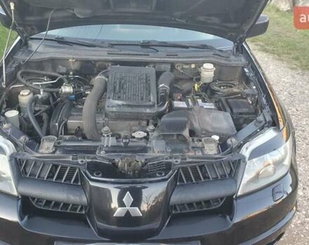 Міцубісі Аутлендер 2006 у Івано-Франківську на Automoto.ua Чорний Міцубісі Аутлендер, об'ємом двигуна 2 л та пробігом 263 тис. км за 7250 $, фото 9 на Automoto.ua