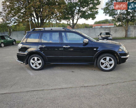 Чорний Міцубісі Аутлендер, об'ємом двигуна 2 л та пробігом 207 тис. км за 6900 $, фото 3 на Automoto.ua