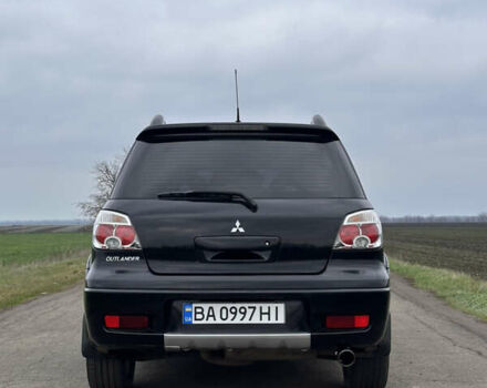 Черный Мицубиси Аутлендер, объемом двигателя 2 л и пробегом 230 тыс. км за 6300 $, фото 3 на Automoto.ua