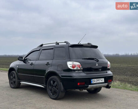Черный Мицубиси Аутлендер, объемом двигателя 2 л и пробегом 230 тыс. км за 6300 $, фото 2 на Automoto.ua