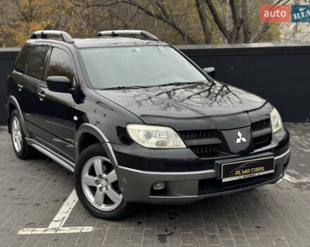 Черный Мицубиси Аутлендер, объемом двигателя 2.4 л и пробегом 242 тыс. км за 6800 $, фото 4 на Automoto.ua