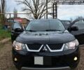 Черный Мицубиси Аутлендер, объемом двигателя 2 л и пробегом 280 тыс. км за 10500 $, фото 1 на Automoto.ua