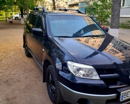 Черный Мицубиси Аутлендер, объемом двигателя 2 л и пробегом 226 тыс. км за 7000 $, фото 1 на Automoto.ua