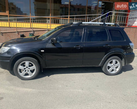 Черный Мицубиси Аутлендер, объемом двигателя 2 л и пробегом 212 тыс. км за 6000 $, фото 4 на Automoto.ua
