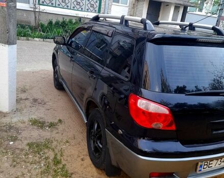 Черный Мицубиси Аутлендер, объемом двигателя 2 л и пробегом 226 тыс. км за 7000 $, фото 4 на Automoto.ua