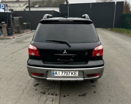 Чорний Міцубісі Аутлендер, об'ємом двигуна 2 л та пробігом 297 тис. км за 6200 $, фото 3 на Automoto.ua