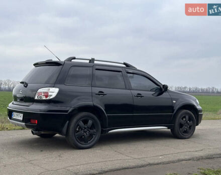 Черный Мицубиси Аутлендер, объемом двигателя 2 л и пробегом 230 тыс. км за 6300 $, фото 4 на Automoto.ua