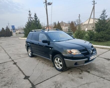 Черный Мицубиси Аутлендер, объемом двигателя 2 л и пробегом 169 тыс. км за 3500 $, фото 3 на Automoto.ua