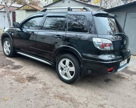 Черный Мицубиси Аутлендер, объемом двигателя 2.4 л и пробегом 256 тыс. км за 6900 $, фото 3 на Automoto.ua