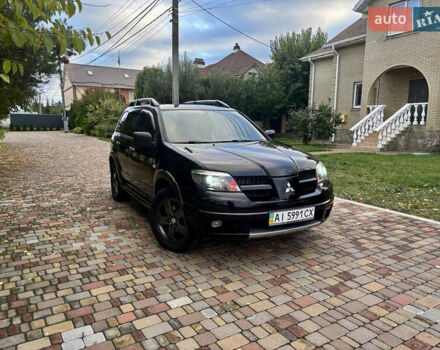 Чорний Міцубісі Аутлендер, об'ємом двигуна 2.38 л та пробігом 247 тис. км за 5499 $, фото 34 на Automoto.ua
