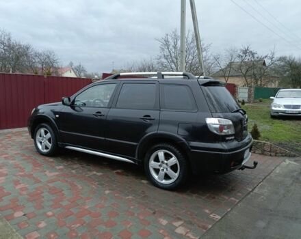 Черный Мицубиси Аутлендер, объемом двигателя 2 л и пробегом 200 тыс. км за 5100 $, фото 4 на Automoto.ua