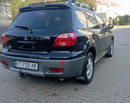 Черный Мицубиси Аутлендер, объемом двигателя 2 л и пробегом 297 тыс. км за 5800 $, фото 11 на Automoto.ua