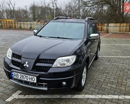 Черный Мицубиси Аутлендер, объемом двигателя 2.4 л и пробегом 167 тыс. км за 6150 $, фото 5 на Automoto.ua
