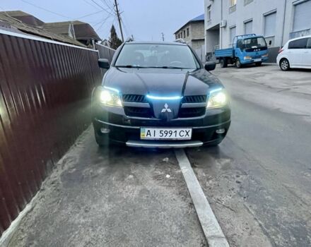 Черный Мицубиси Аутлендер, объемом двигателя 2.4 л и пробегом 234 тыс. км за 5499 $, фото 2 на Automoto.ua