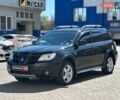 Черный Мицубиси Аутлендер, объемом двигателя 2.4 л и пробегом 252 тыс. км за 6990 $, фото 1 на Automoto.ua