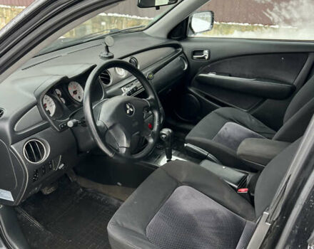 Чорний Міцубісі Аутлендер, об'ємом двигуна 2.4 л та пробігом 308 тис. км за 4700 $, фото 8 на Automoto.ua