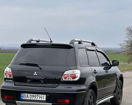 Черный Мицубиси Аутлендер, объемом двигателя 2 л и пробегом 230 тыс. км за 6300 $, фото 13 на Automoto.ua