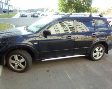 Черный Мицубиси Аутлендер, объемом двигателя 2.4 л и пробегом 240 тыс. км за 5700 $, фото 1 на Automoto.ua