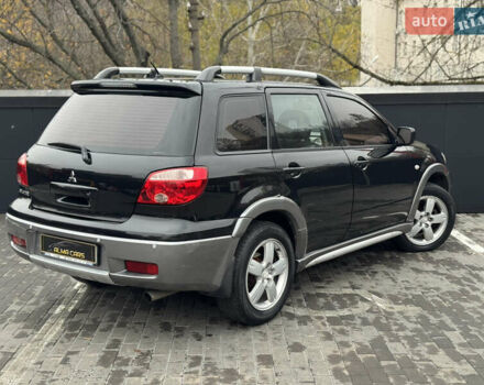 Черный Мицубиси Аутлендер, объемом двигателя 2.4 л и пробегом 242 тыс. км за 6800 $, фото 12 на Automoto.ua