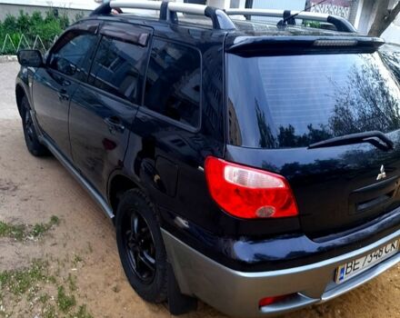 Черный Мицубиси Аутлендер, объемом двигателя 2 л и пробегом 226 тыс. км за 7000 $, фото 5 на Automoto.ua