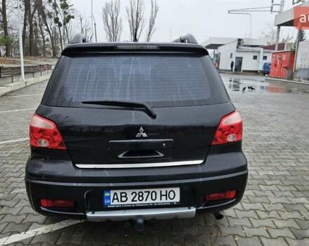 Черный Мицубиси Аутлендер, объемом двигателя 2.4 л и пробегом 167 тыс. км за 6150 $, фото 11 на Automoto.ua