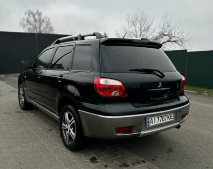 Чорний Міцубісі Аутлендер, об'ємом двигуна 2 л та пробігом 297 тис. км за 6200 $, фото 2 на Automoto.ua