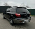 Чорний Міцубісі Аутлендер, об'ємом двигуна 2 л та пробігом 297 тис. км за 6200 $, фото 2 на Automoto.ua