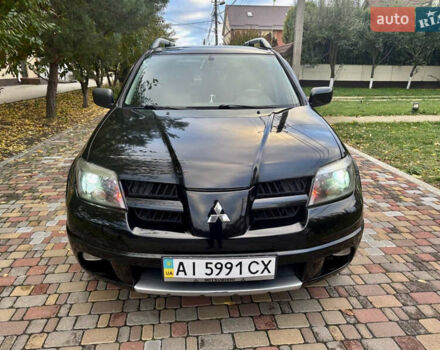 Чорний Міцубісі Аутлендер, об'ємом двигуна 2.38 л та пробігом 247 тис. км за 5499 $, фото 4 на Automoto.ua
