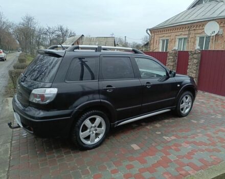 Черный Мицубиси Аутлендер, объемом двигателя 2 л и пробегом 200 тыс. км за 5100 $, фото 5 на Automoto.ua
