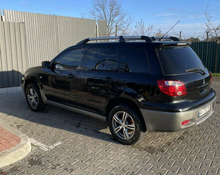 Чорний Міцубісі Аутлендер, об'ємом двигуна 2 л та пробігом 297 тис. км за 6200 $, фото 9 на Automoto.ua