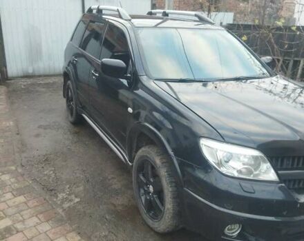 Черный Мицубиси Аутлендер, объемом двигателя 2.4 л и пробегом 280 тыс. км за 5455 $, фото 1 на Automoto.ua