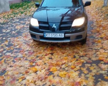 Черный Мицубиси Аутлендер, объемом двигателя 2 л и пробегом 297 тыс. км за 5800 $, фото 2 на Automoto.ua