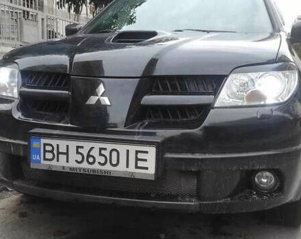 Черный Мицубиси Аутлендер, объемом двигателя 2 л и пробегом 216 тыс. км за 5600 $, фото 1 на Automoto.ua
