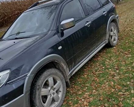 Чорний Міцубісі Аутлендер, об'ємом двигуна 2 л та пробігом 320 тис. км за 4500 $, фото 4 на Automoto.ua