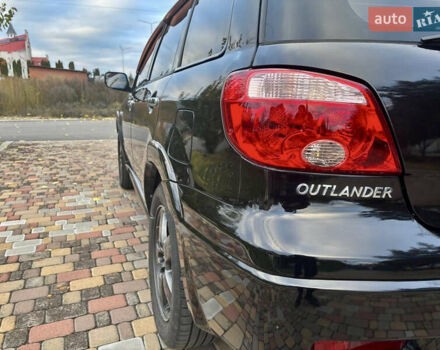 Чорний Міцубісі Аутлендер, об'ємом двигуна 2.38 л та пробігом 247 тис. км за 5499 $, фото 15 на Automoto.ua