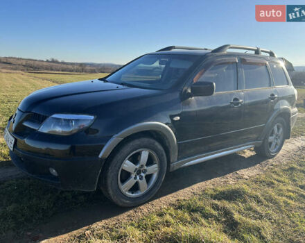 Черный Мицубиси Аутлендер, объемом двигателя 2.38 л и пробегом 230 тыс. км за 5350 $, фото 7 на Automoto.ua