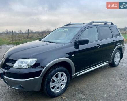 Черный Мицубиси Аутлендер, объемом двигателя 2 л и пробегом 130 тыс. км за 6999 $, фото 5 на Automoto.ua