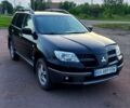 Черный Мицубиси Аутлендер, объемом двигателя 2 л и пробегом 190 тыс. км за 7000 $, фото 1 на Automoto.ua