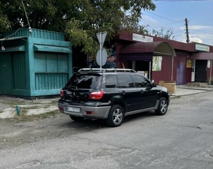 Черный Мицубиси Аутлендер, объемом двигателя 2 л и пробегом 297 тыс. км за 6500 $, фото 3 на Automoto.ua