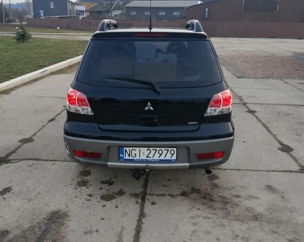 Черный Мицубиси Аутлендер, объемом двигателя 2 л и пробегом 169 тыс. км за 3500 $, фото 5 на Automoto.ua