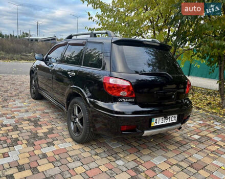 Чорний Міцубісі Аутлендер, об'ємом двигуна 2.38 л та пробігом 247 тис. км за 5499 $, фото 14 на Automoto.ua