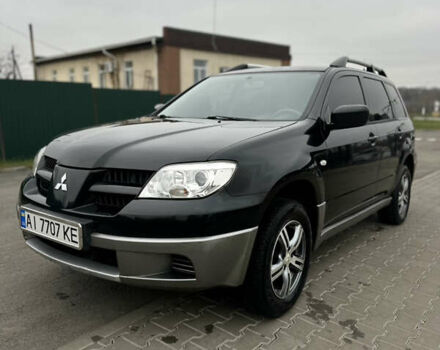 Чорний Міцубісі Аутлендер, об'ємом двигуна 2 л та пробігом 297 тис. км за 6200 $, фото 1 на Automoto.ua