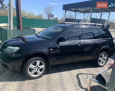 Черный Мицубиси Аутлендер, объемом двигателя 2 л и пробегом 212 тыс. км за 6000 $, фото 25 на Automoto.ua